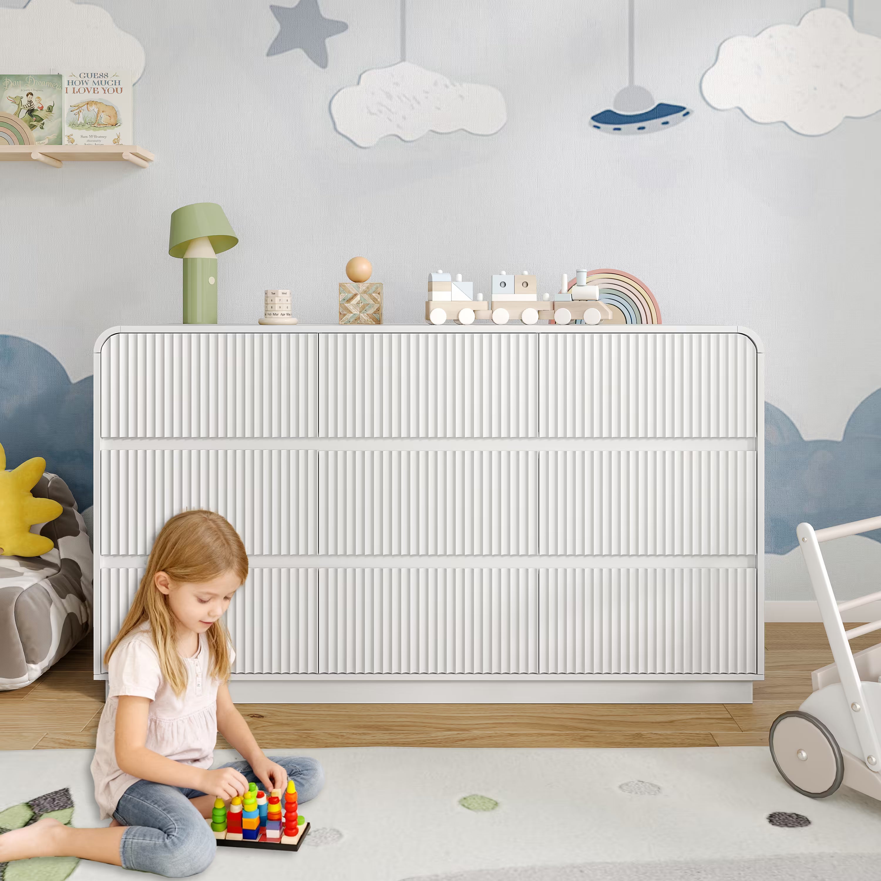 Premium 9 drawer fluted white wood dresser decorated with charming nursery accessories