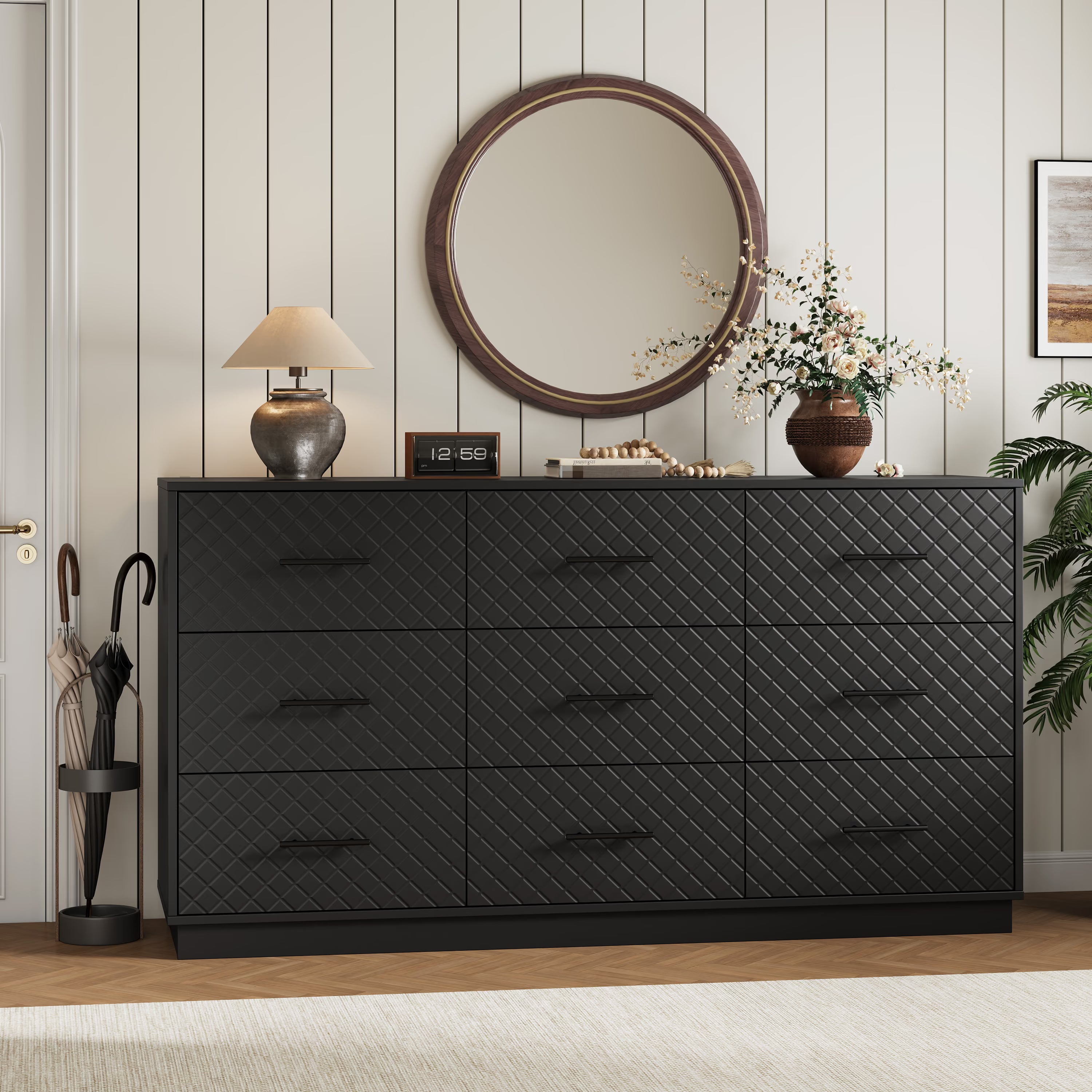 Black 9-drawer double dresser styled in an entryway with a round mirror