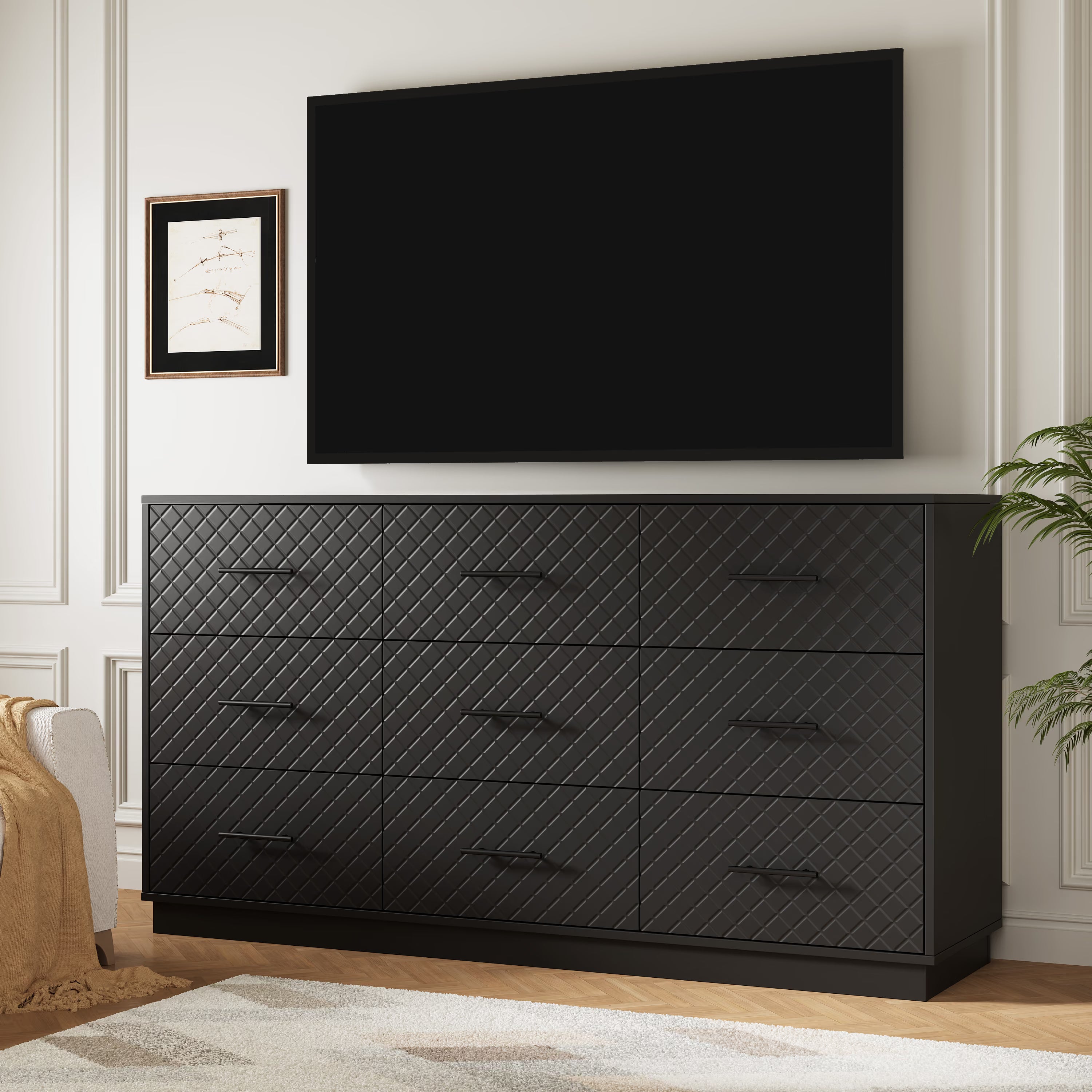 Black 9-drawer double dresser used as a TV stand under a wall-mounted TV