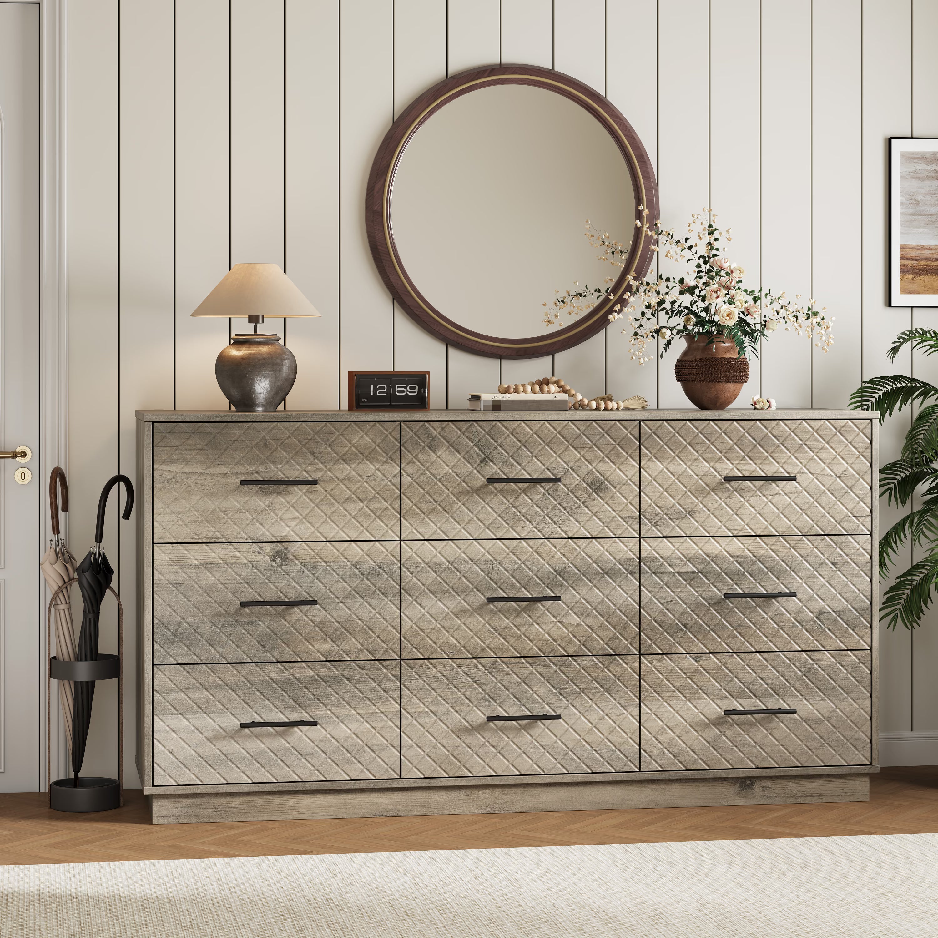 Wood gray 9-drawer double dresser styled in an entryway with a round mirror