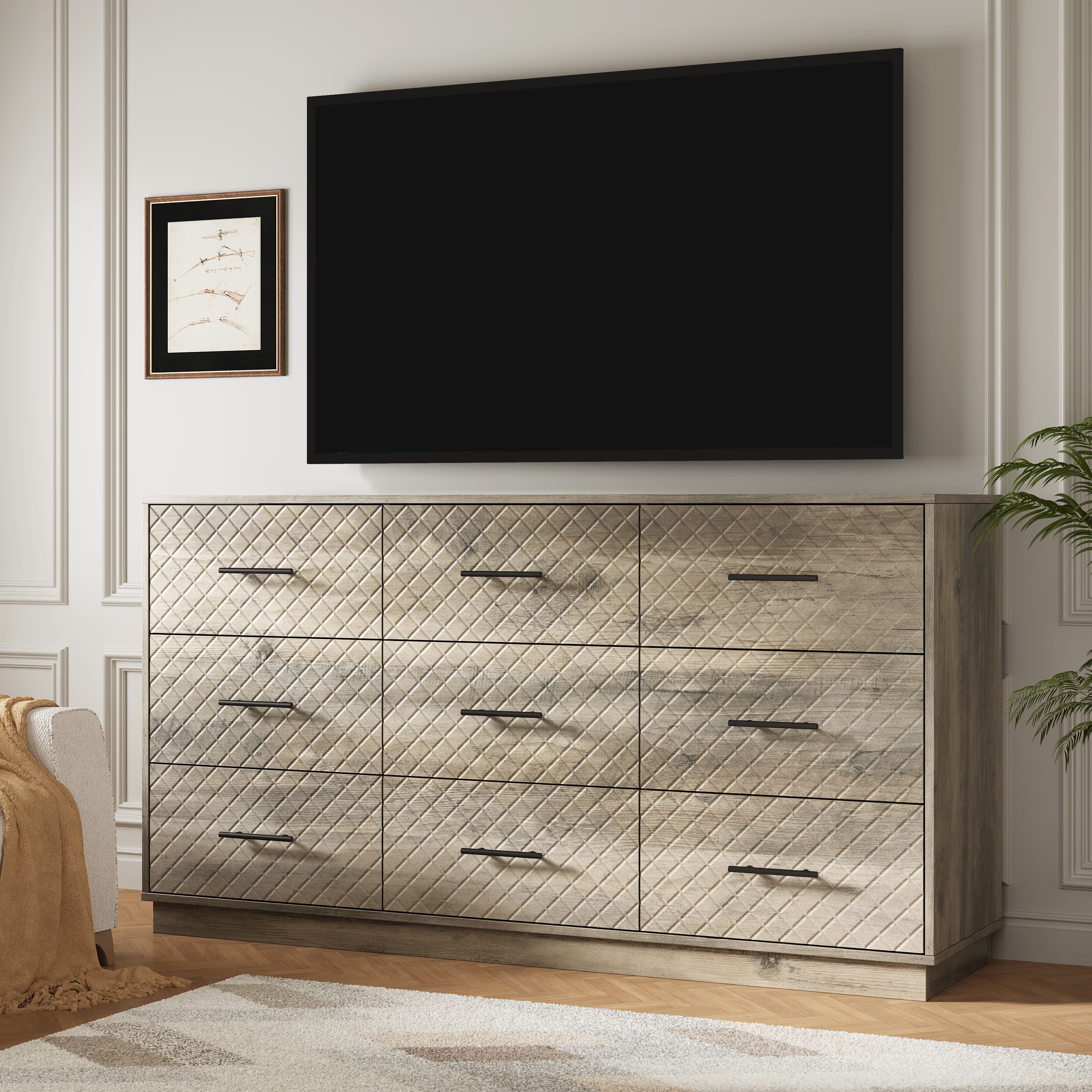 Wood gray 9-drawer double dresser used as a TV stand under a wall-mounted TV