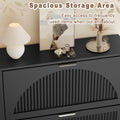 Elora black shoe storage cabinet with decor on the top surface