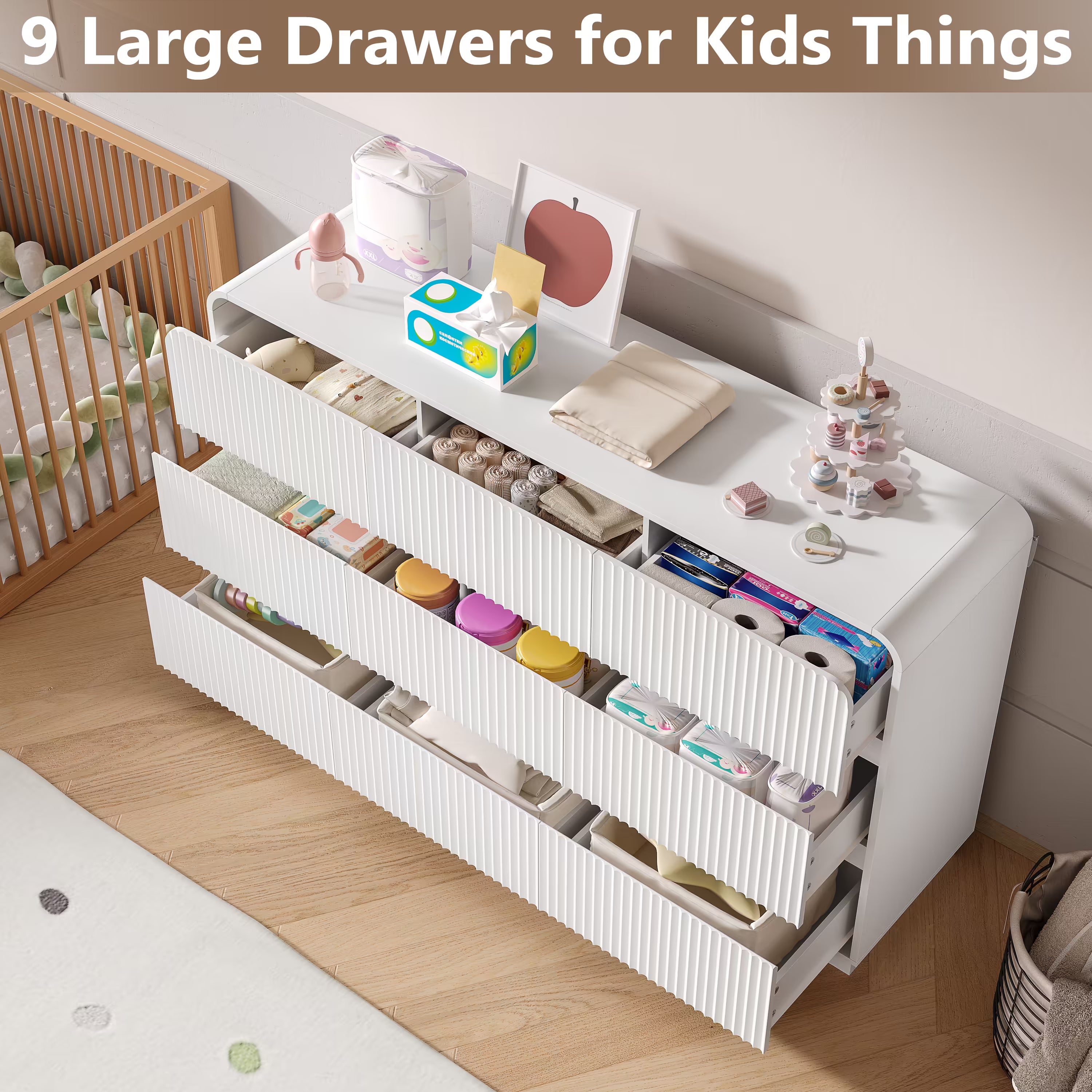 White kids dresser featuring 9 large drawers perfectly organizing diapers clothes and nursery essentials