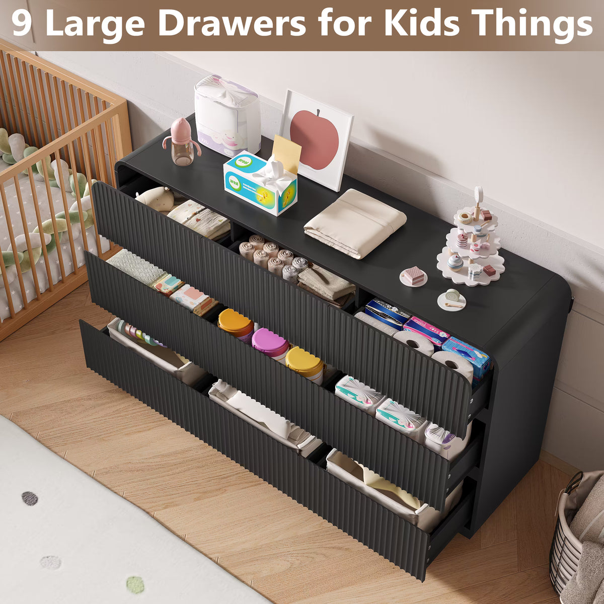 Black kids dresser featuring 9 large drawers perfectly organizing diapers clothes and nursery essentials