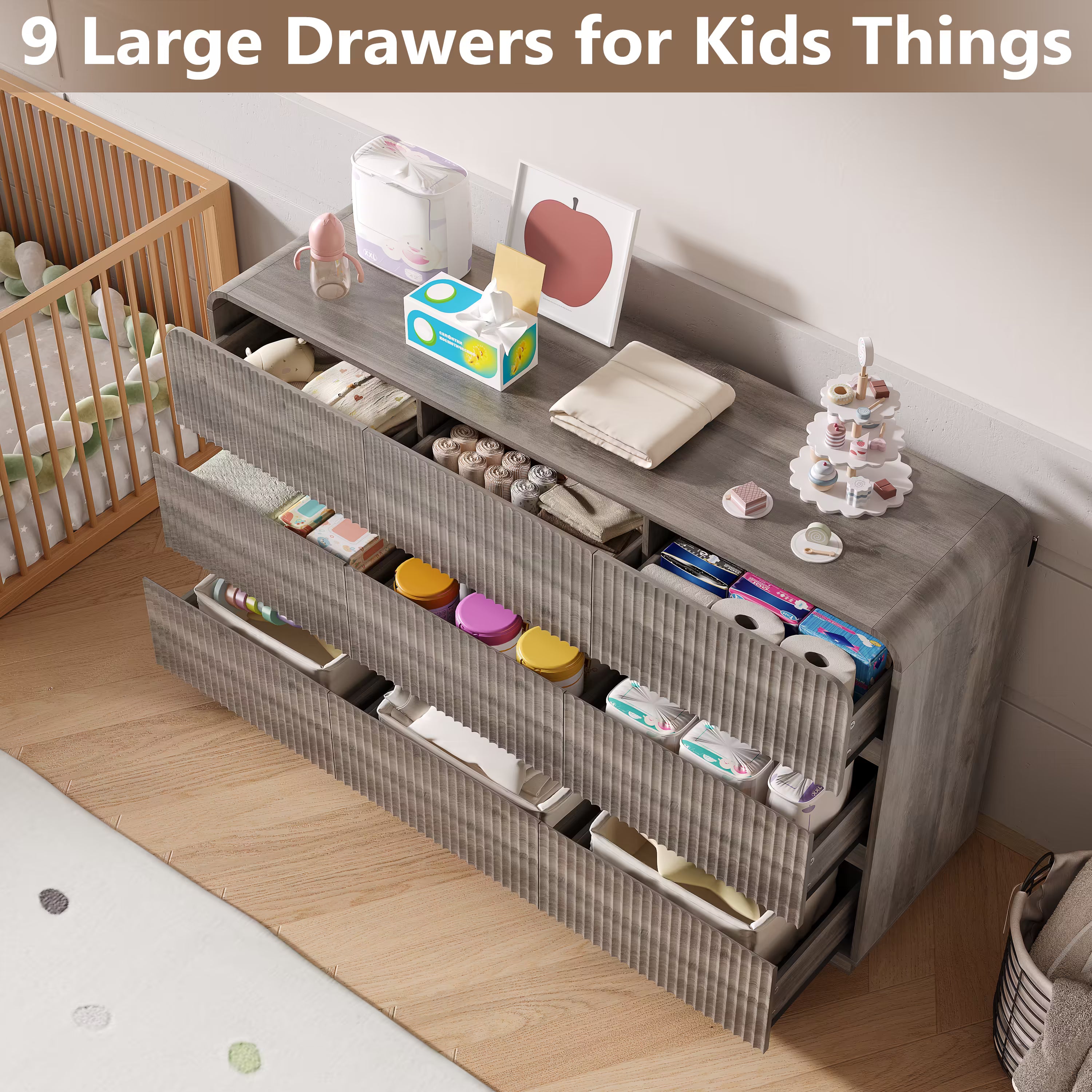 Gray kids dresser featuring 9 large drawers perfectly organizing diapers clothes and nursery essentials