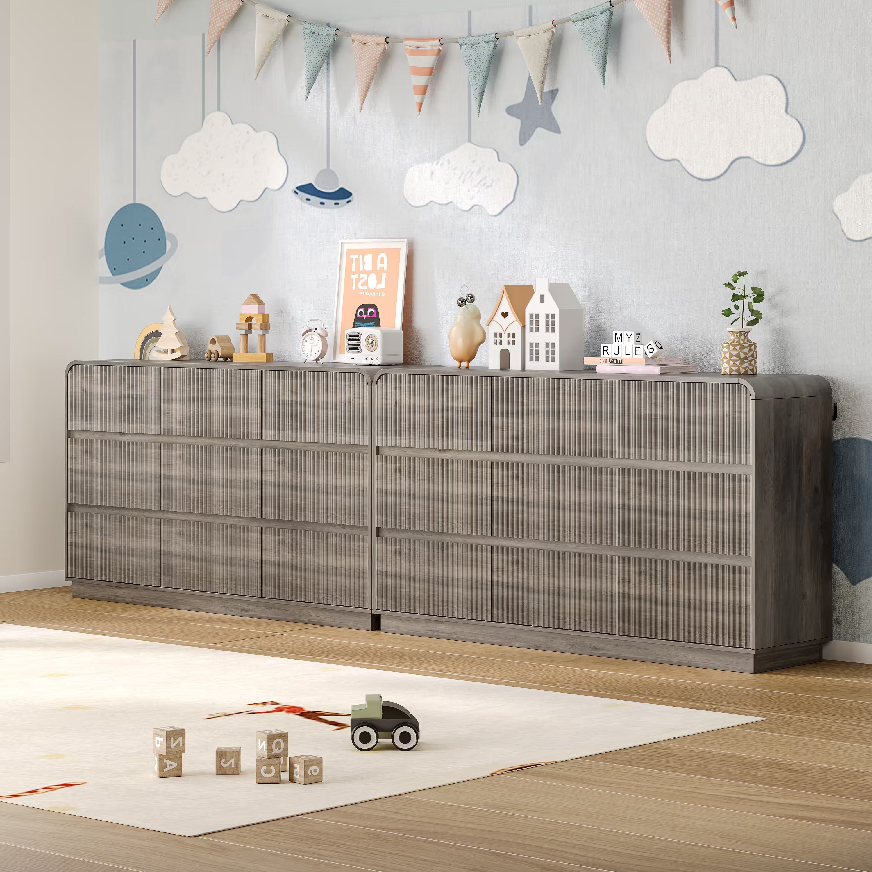 Child playing safely on the floor next to a sturdy fluted gray wood kids dresser
