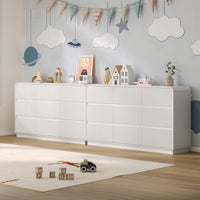 Child playing safely on the floor next to a sturdy fluted white wood kids dresser