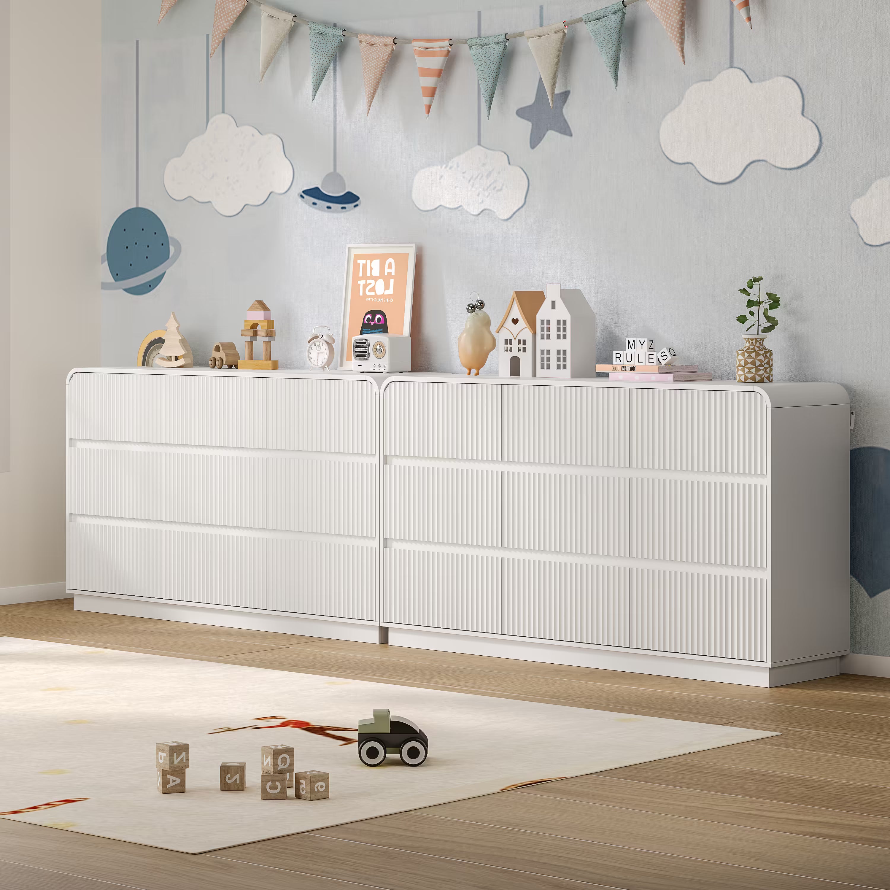 Child playing safely on the floor next to a sturdy fluted white wood kids dresser
