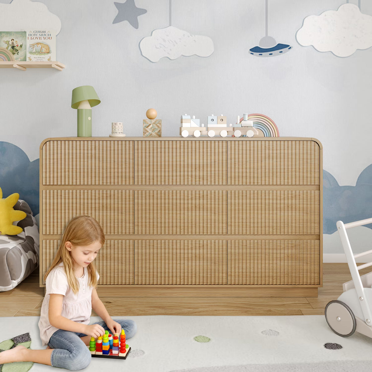 Premium 9 drawer fluted oak wood dresser decorated with charming nursery accessories