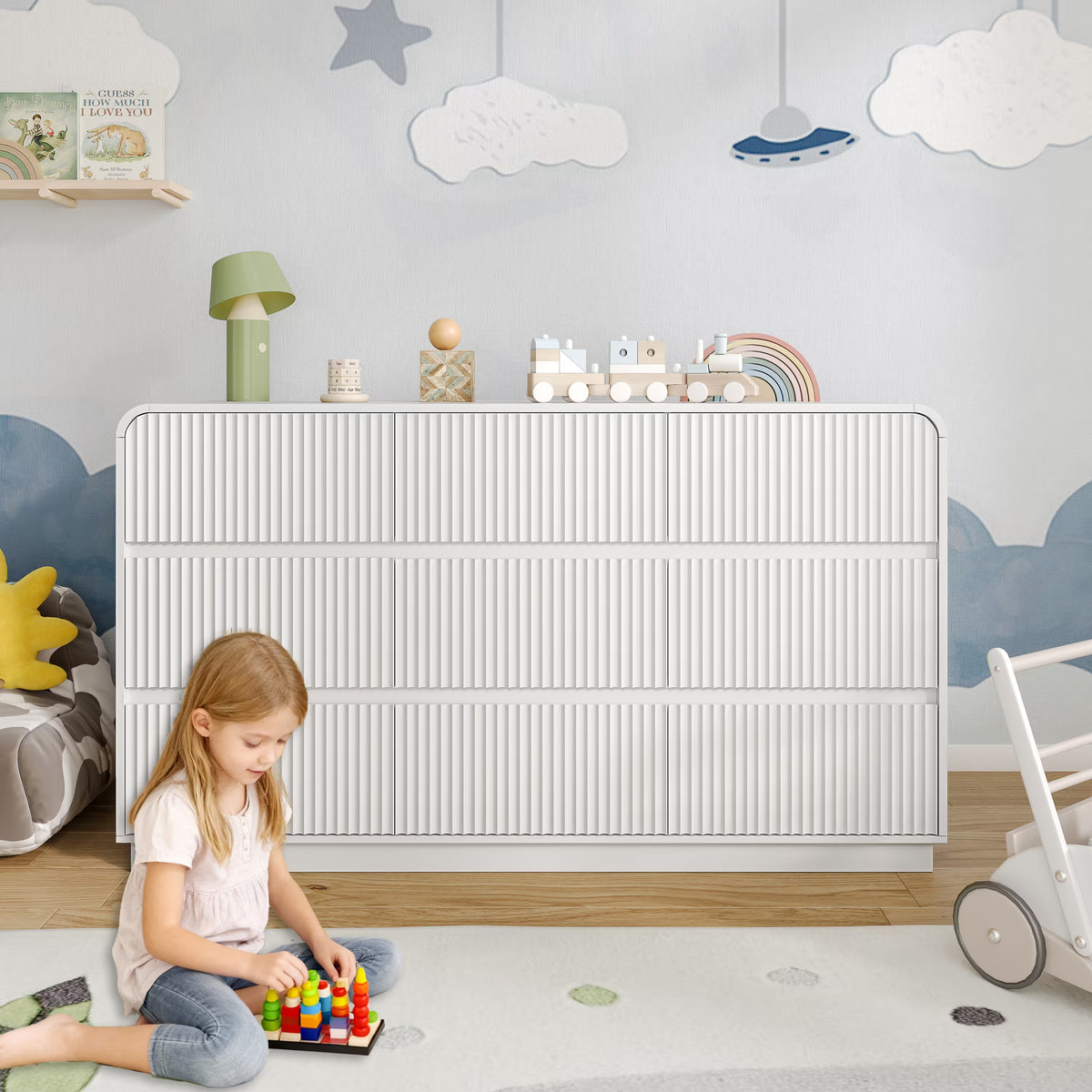 Premium 9 drawer fluted white wood dresser decorated with charming nursery accessories