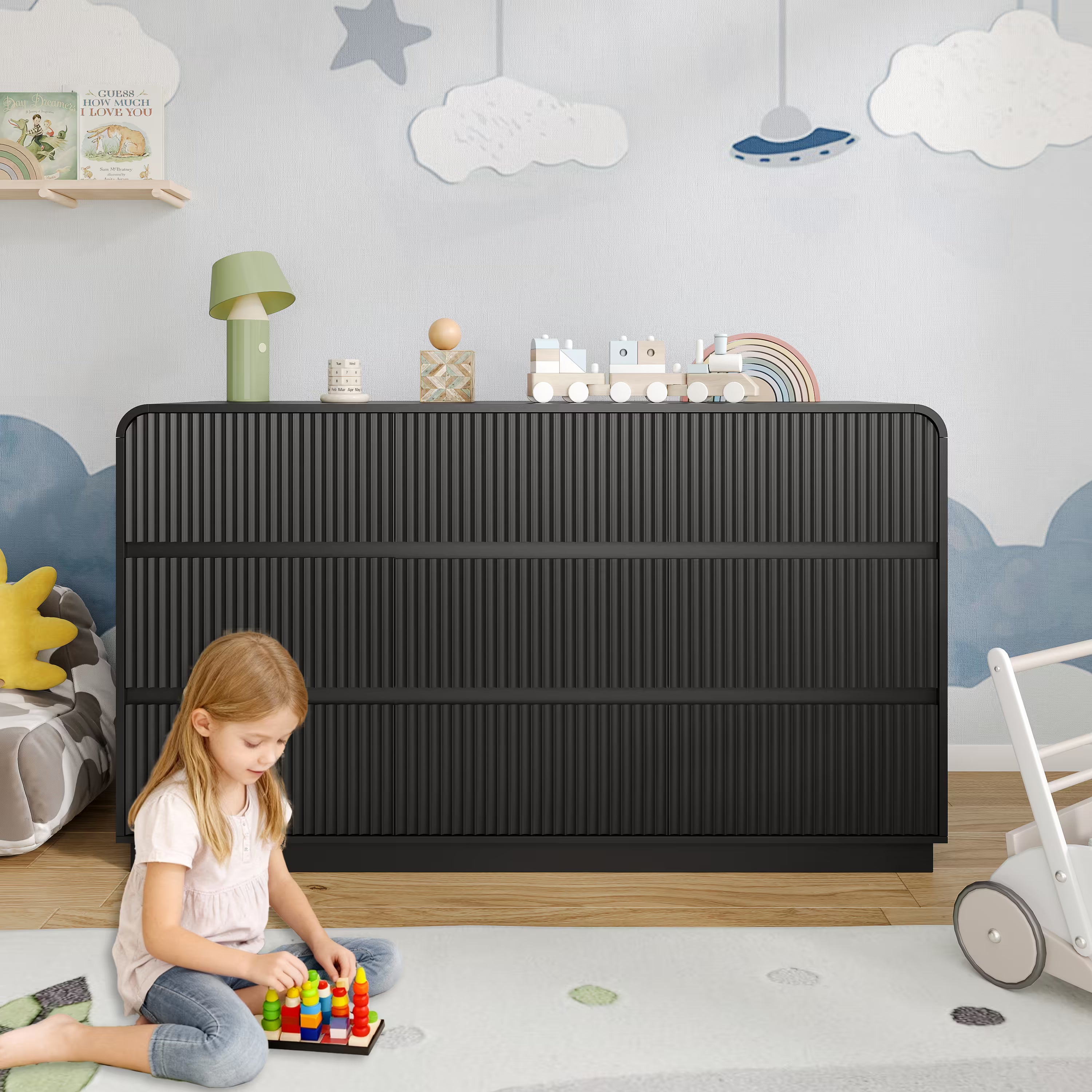 Premium 9 drawer fluted black wood dresser decorated with charming nursery accessories