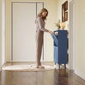 Elora blue slim shoe cabinet shown from the side in a narrow entryway