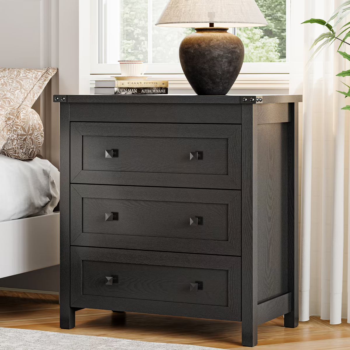 Black farmhouse nightstand with 3 drawers styled beside bed with lamp