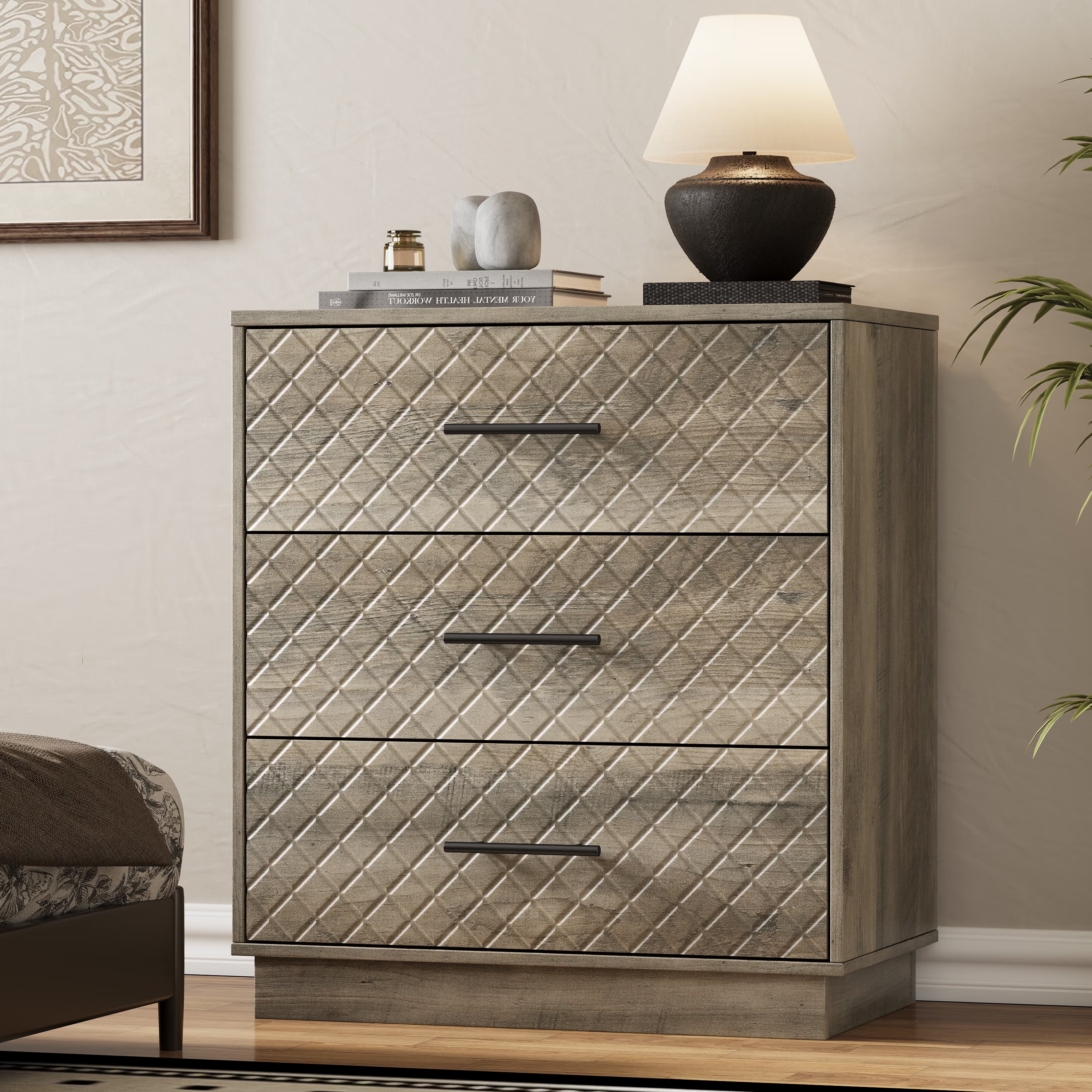 Wood gray Prisma 3-drawer dresser with diamond line fronts and gold handles in a modern bedroom