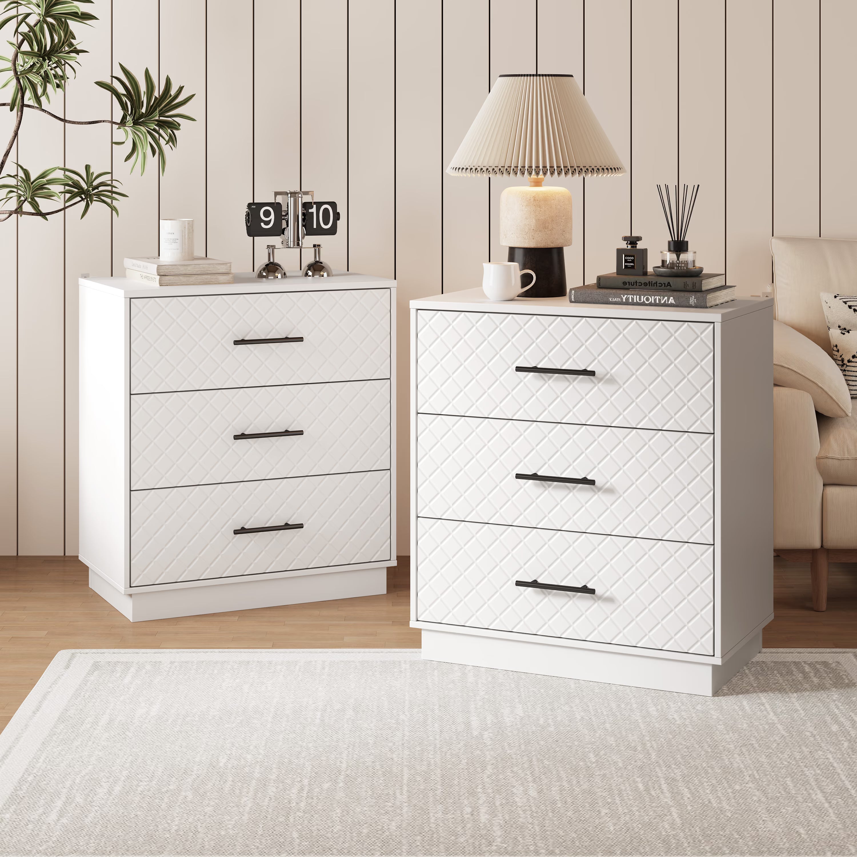 Set of two white 3-drawer dressers styled together in a living room