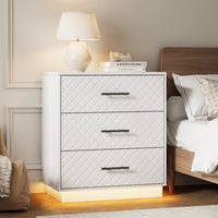White 3-drawer dresser with warm LED base light styled as a bedside nightstand