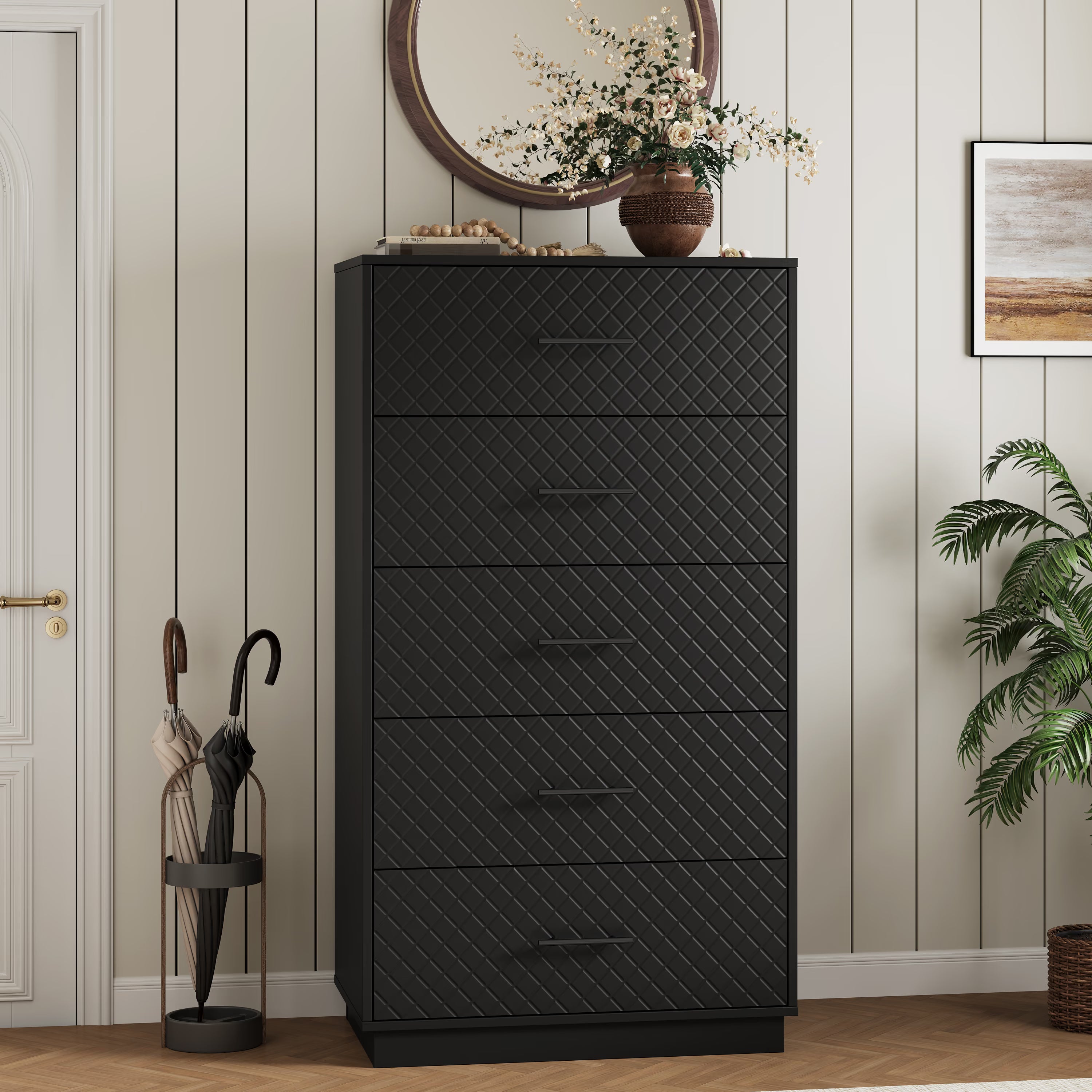 Black tall 5-drawer dresser styled in an entryway with a round mirror