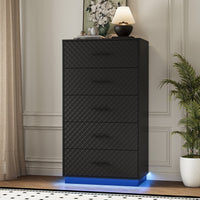 Black Prisma tall 5-drawer dresser with diamond line fronts and LED base lighting in a modern living room