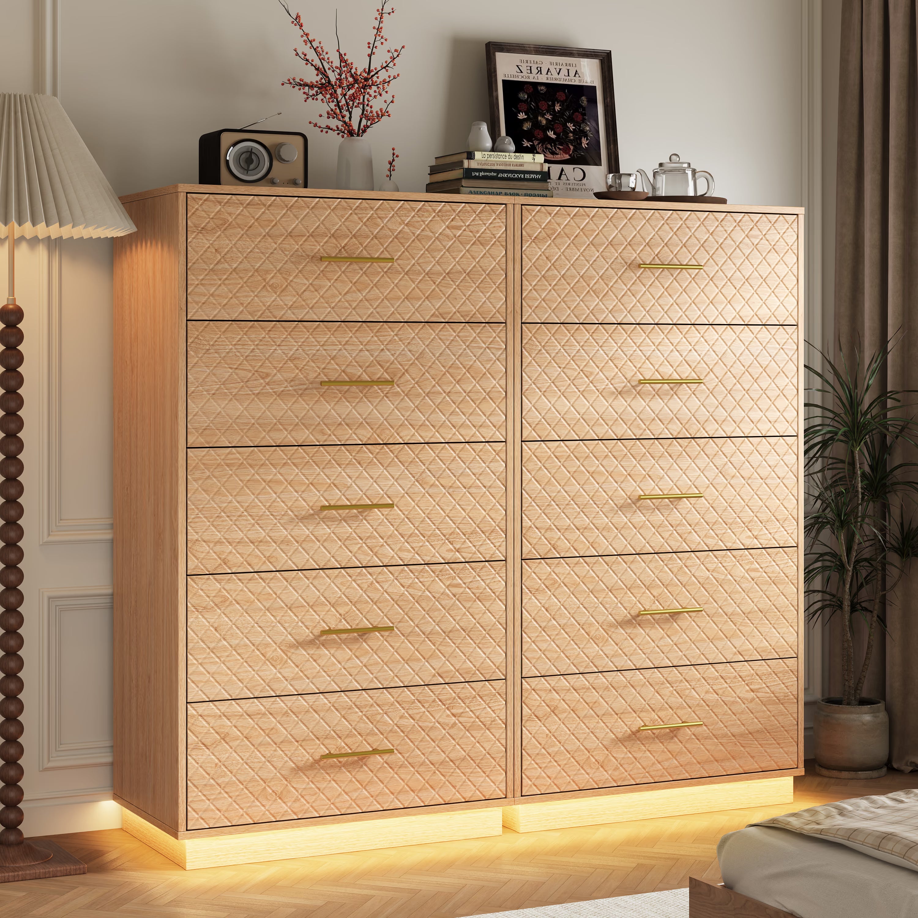 Set of two oak wood tall 5-drawer dressers with warm LED base light in a bedroom