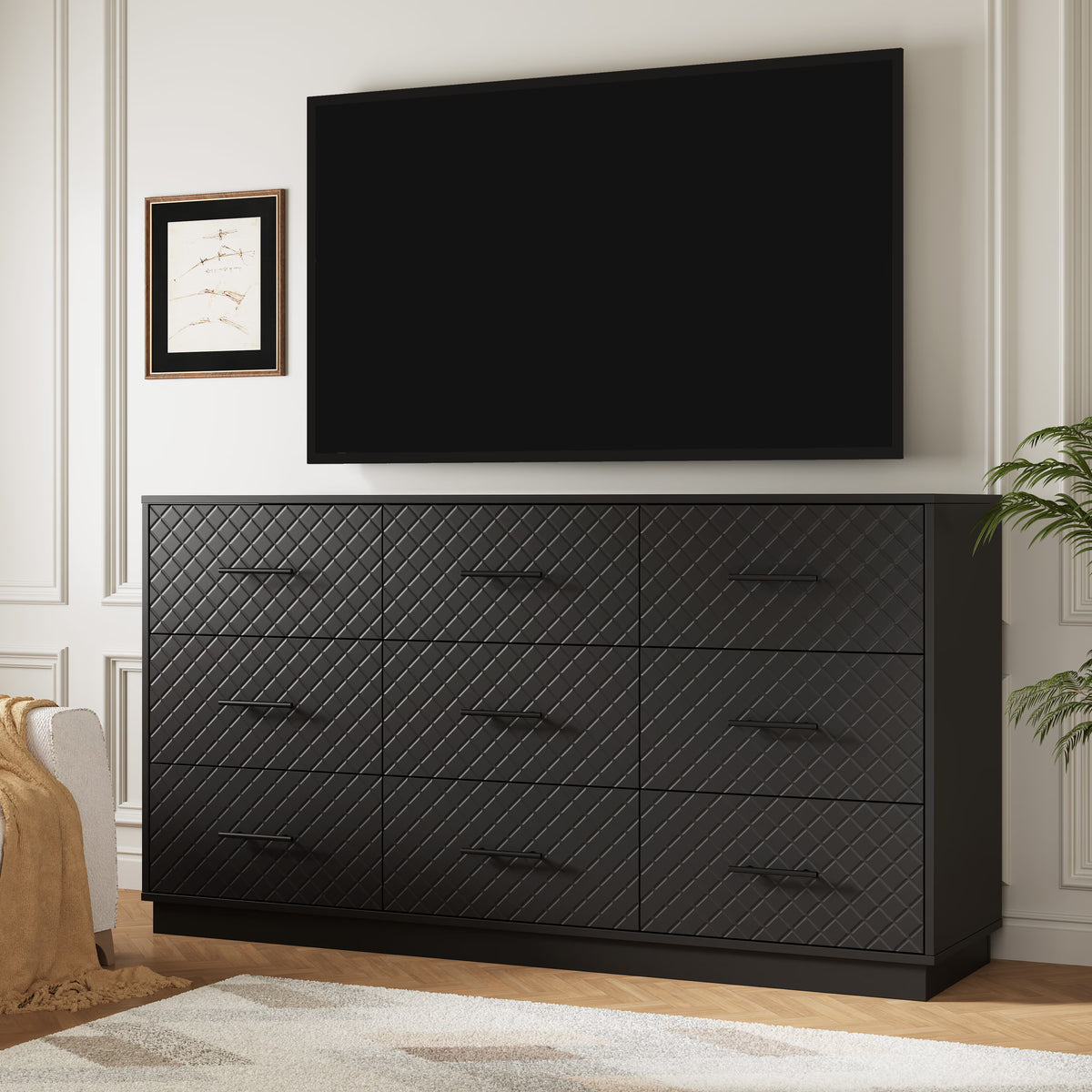 Black 9-drawer double dresser used as a TV stand under a wall-mounted TV