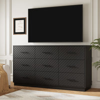 Black 9-drawer double dresser used as a TV stand under a wall-mounted TV