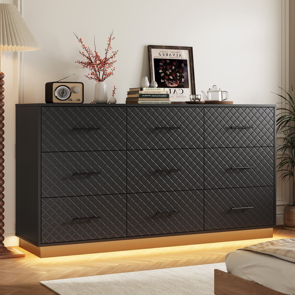 Black 9-drawer dresser with warm LED light strip glowing in a bedroom