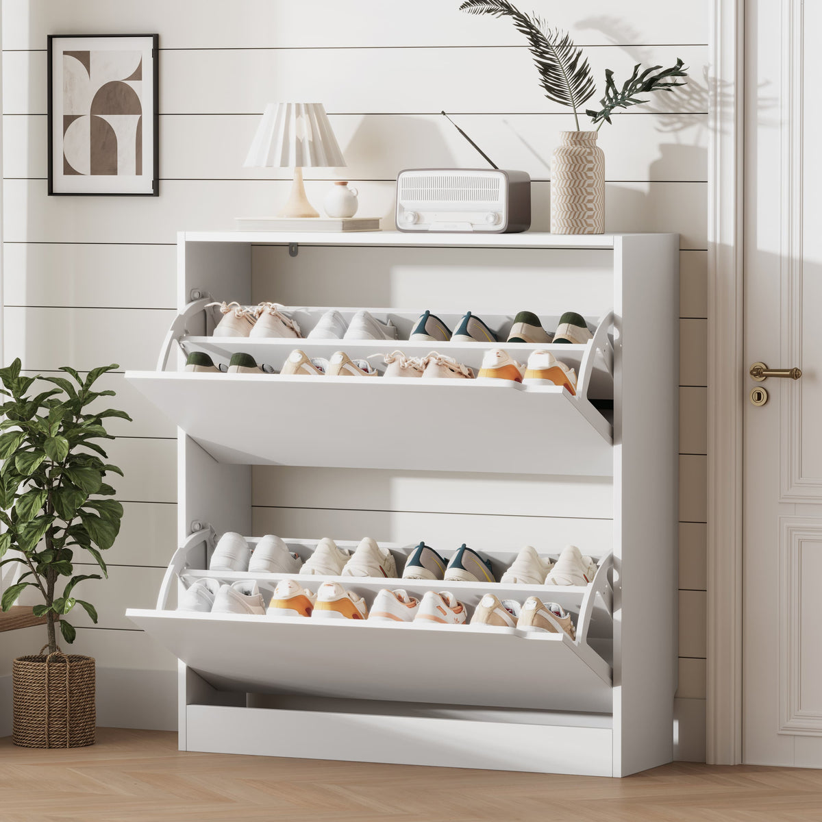 A modern white shoe cabinet with doors open, revealing neatly organized footwear. This elegant shoe cabinet entryway furniture saves space while enhancing home decor.