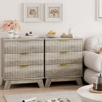 Two Linea gray 3-drawer nightstands placed side by side next to a sofa, creating a wide fluted dresser for extended living room storage.