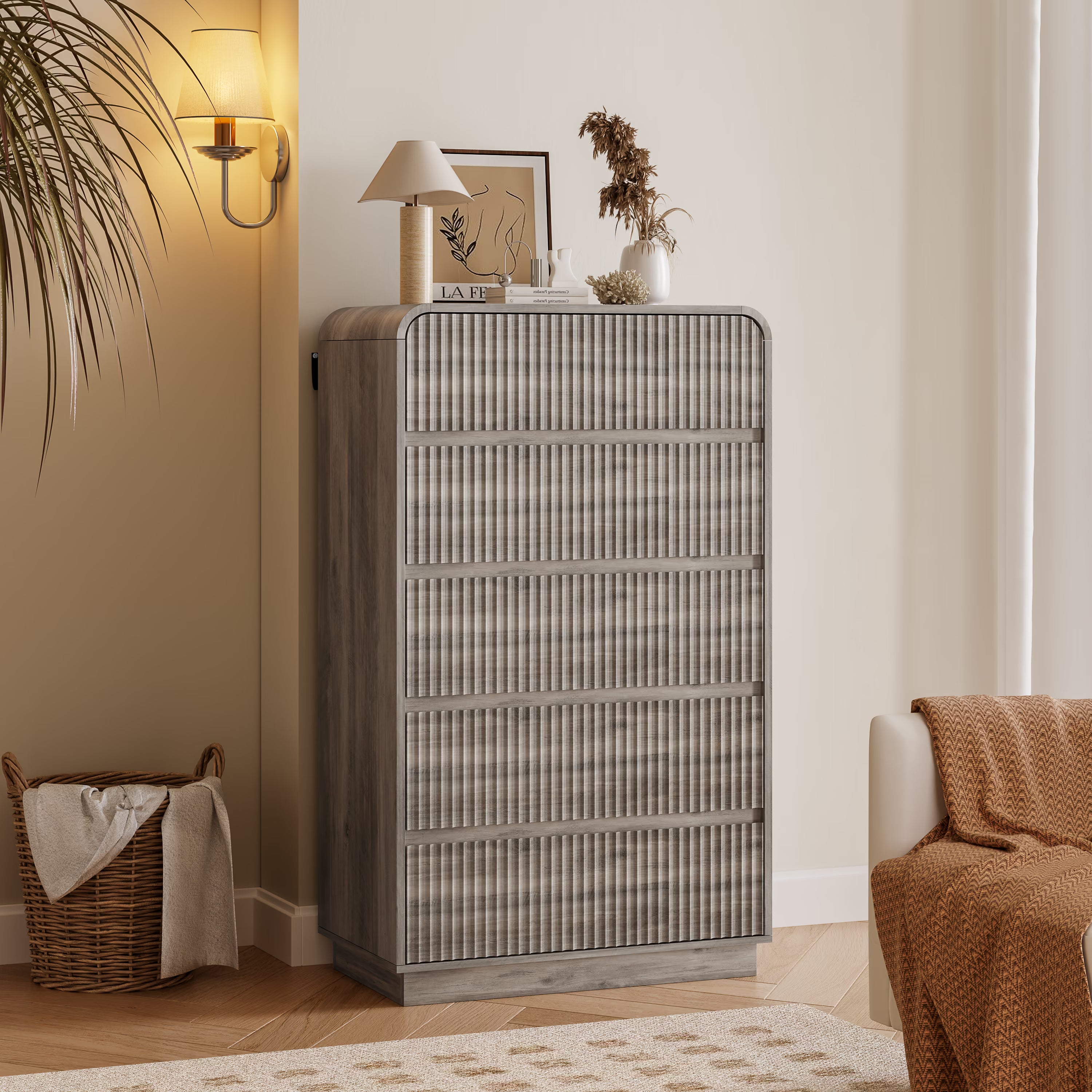 Linea modern gray tall dresser for bedroom with 5 fluted drawers in a cozy living room setting.