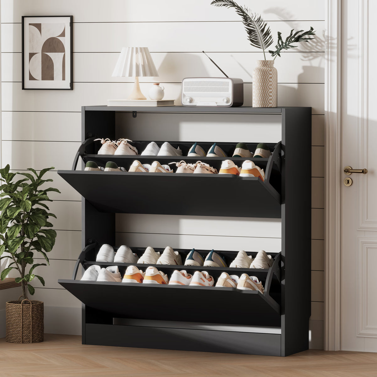A modern black shoe cabinet with doors open, revealing neatly organized footwear. This elegant shoe cabinet entryway furniture saves space while enhancing home decor.