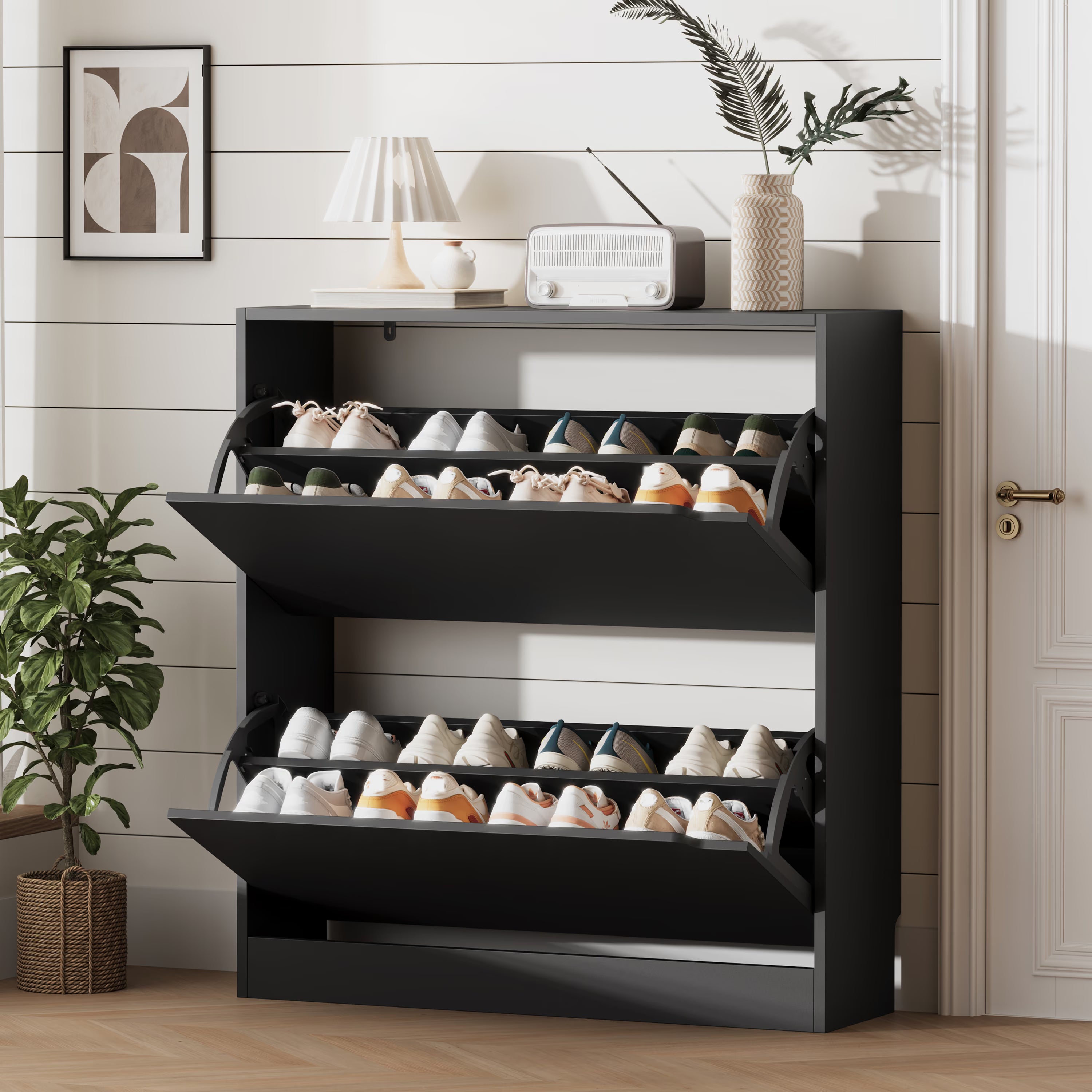 A modern black shoe cabinet with doors open, revealing neatly organized footwear. This elegant shoe cabinet entryway furniture saves space while enhancing home decor.