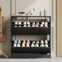 Stylish black entryway shoe cabinet with decorative vases on top, featuring ample shoe cabinet storage for your daily footwear and sneakers.